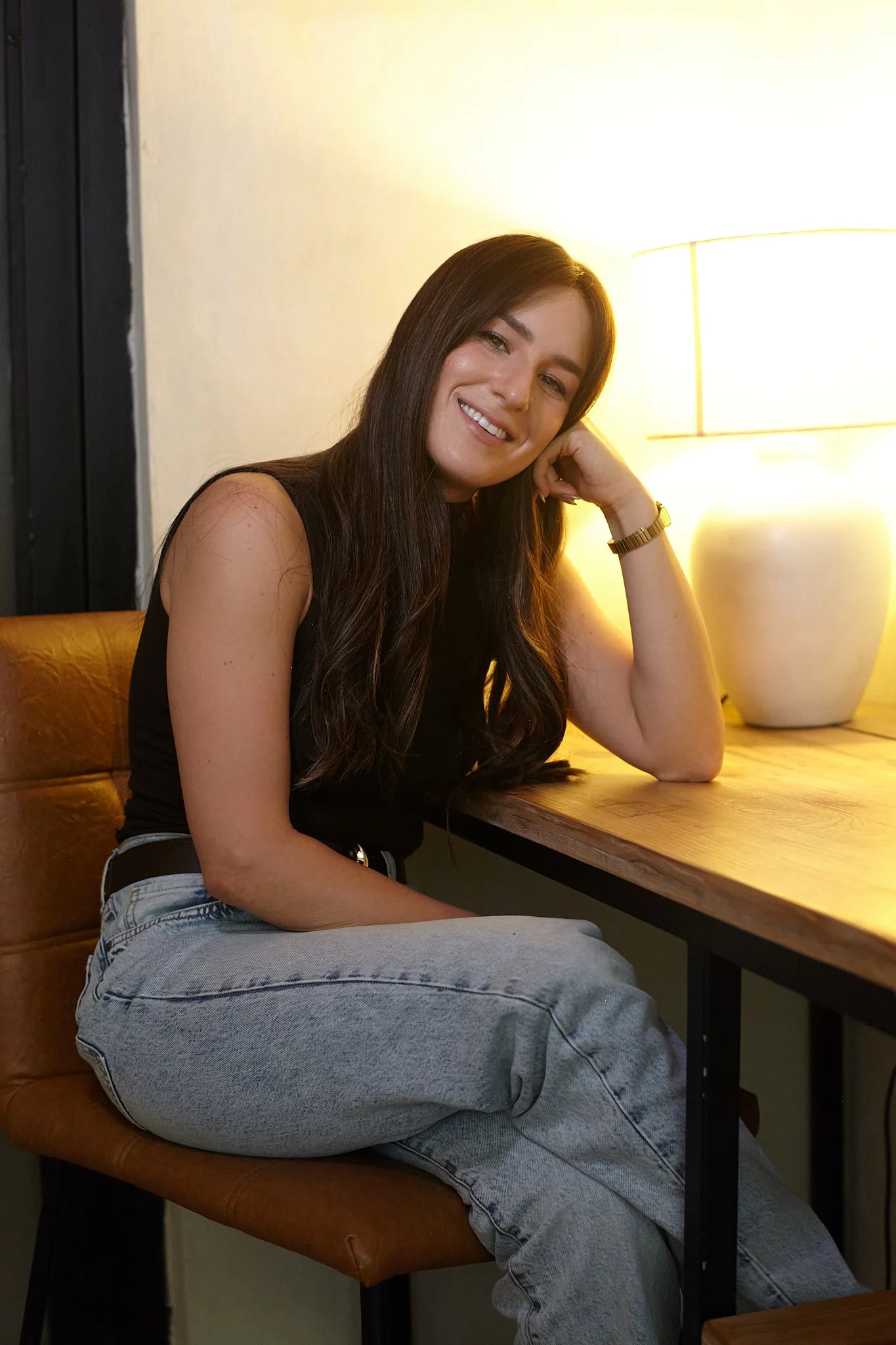 Mattie Chein, LCSW, seated in a warmly lit room